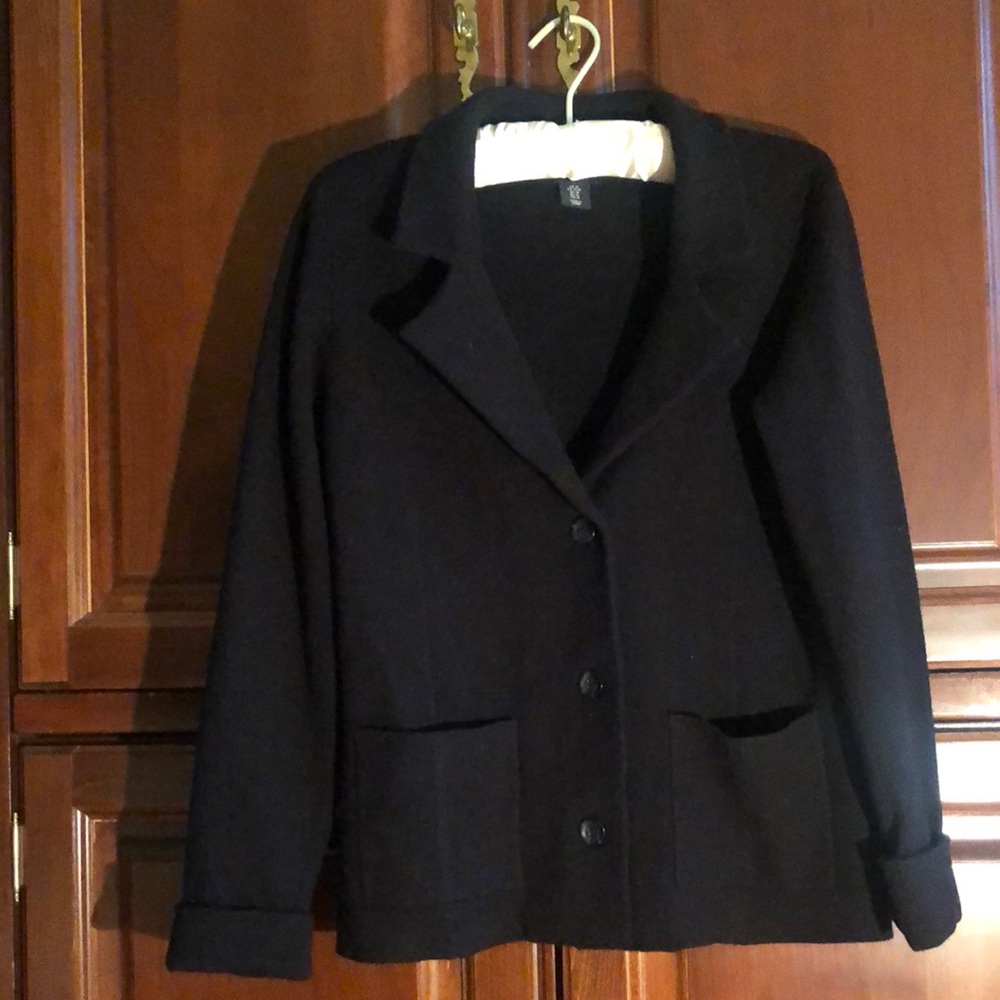 Knit black blazer with patch pockets & a 3 button closure , rolled cuffs